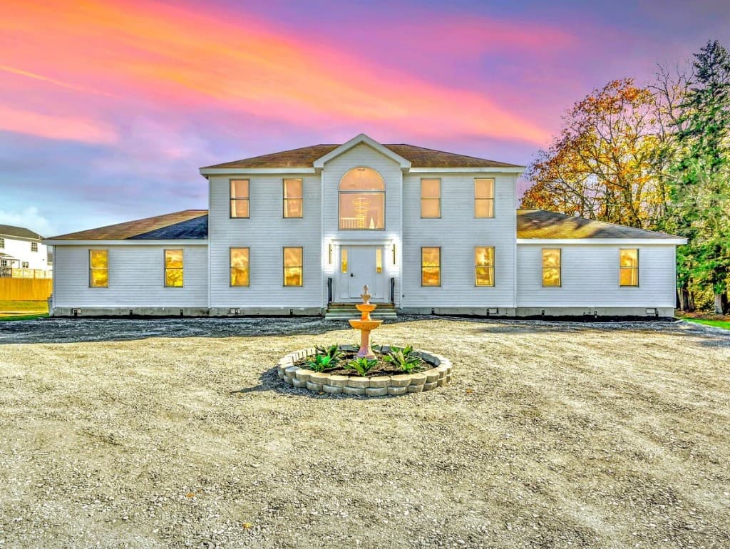 The Leopard single family rental exterior at dusk Mogul Club